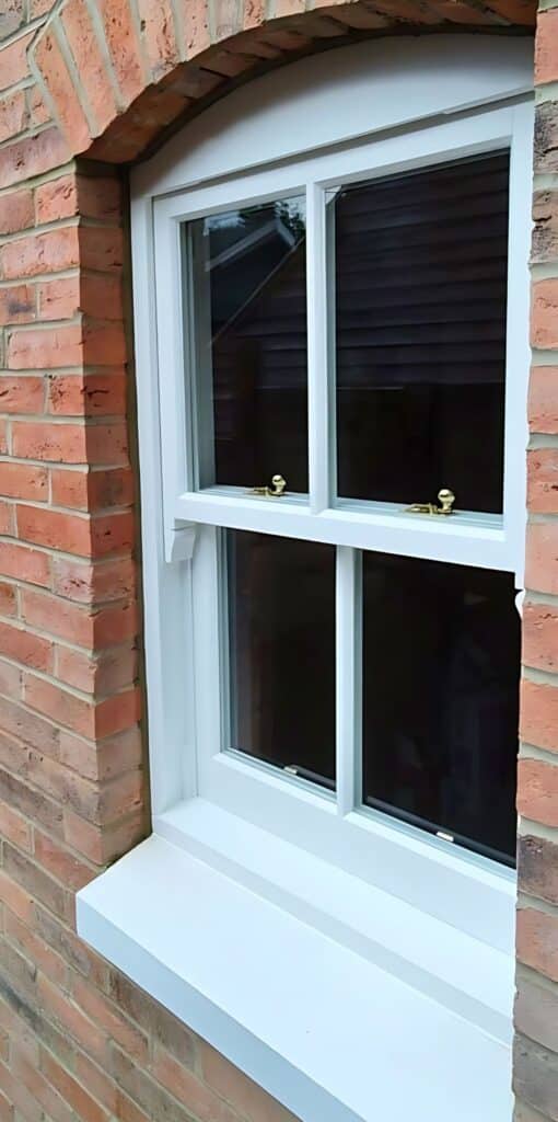 hidden tricklevent in sash window frame head, white painted sliding box sash window