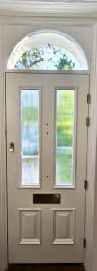 Internal view of Victorian wooden front door with reeded glass