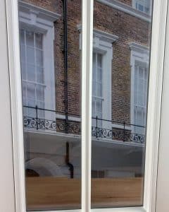 Inside view of vacuum glazing in a timber sash