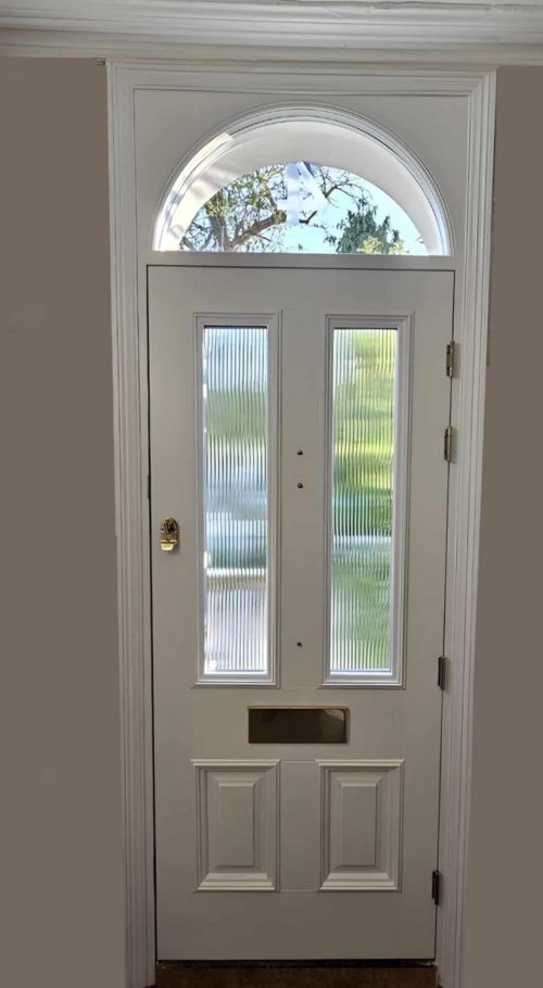 Inside View of Wooden Front Door with Reeded Glass