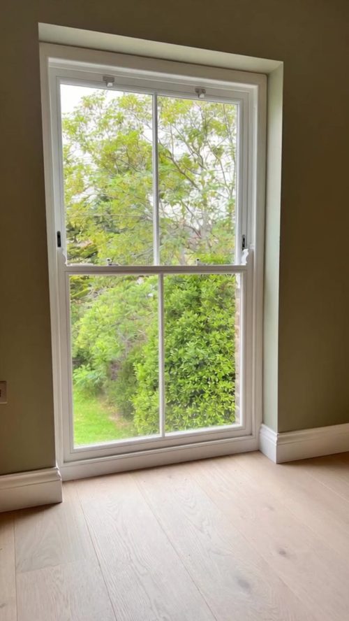 White Timber sash window with laminated double glazing