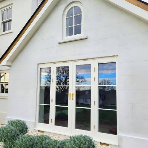 Timber French Door Set in White RAL 9016 Timber French doors on a Home Counties project